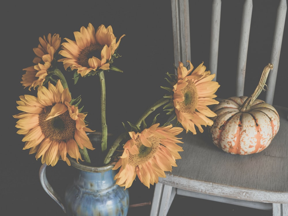 sunflowers on blue ceramic vase