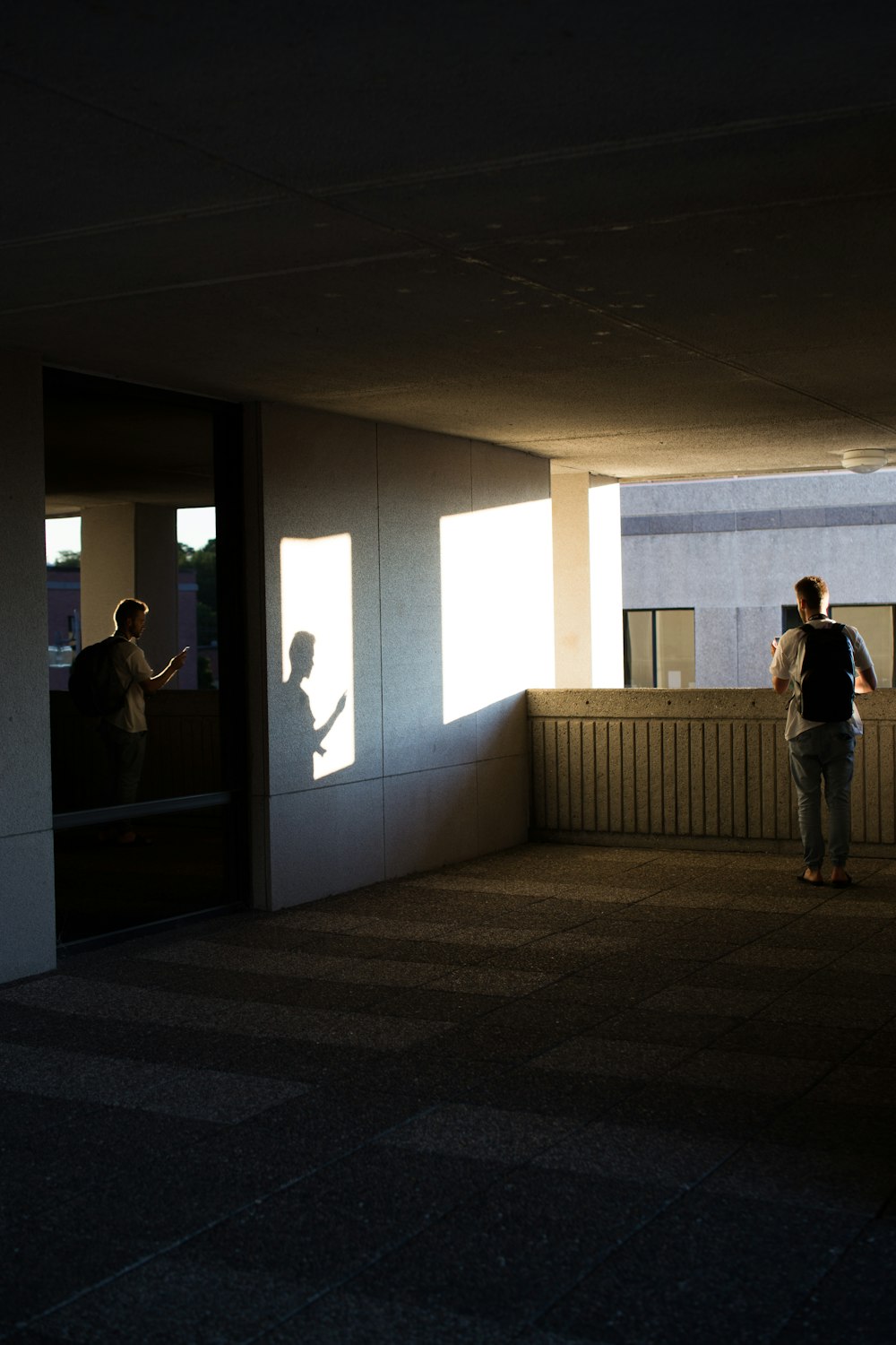 man standing on concrete flooring