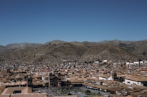 A panoramic view of the city of Sicuani with mountains in the background.