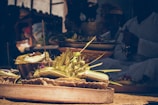 Close-up of fresh flowers and fruits arranged as offerings at the temple altar.