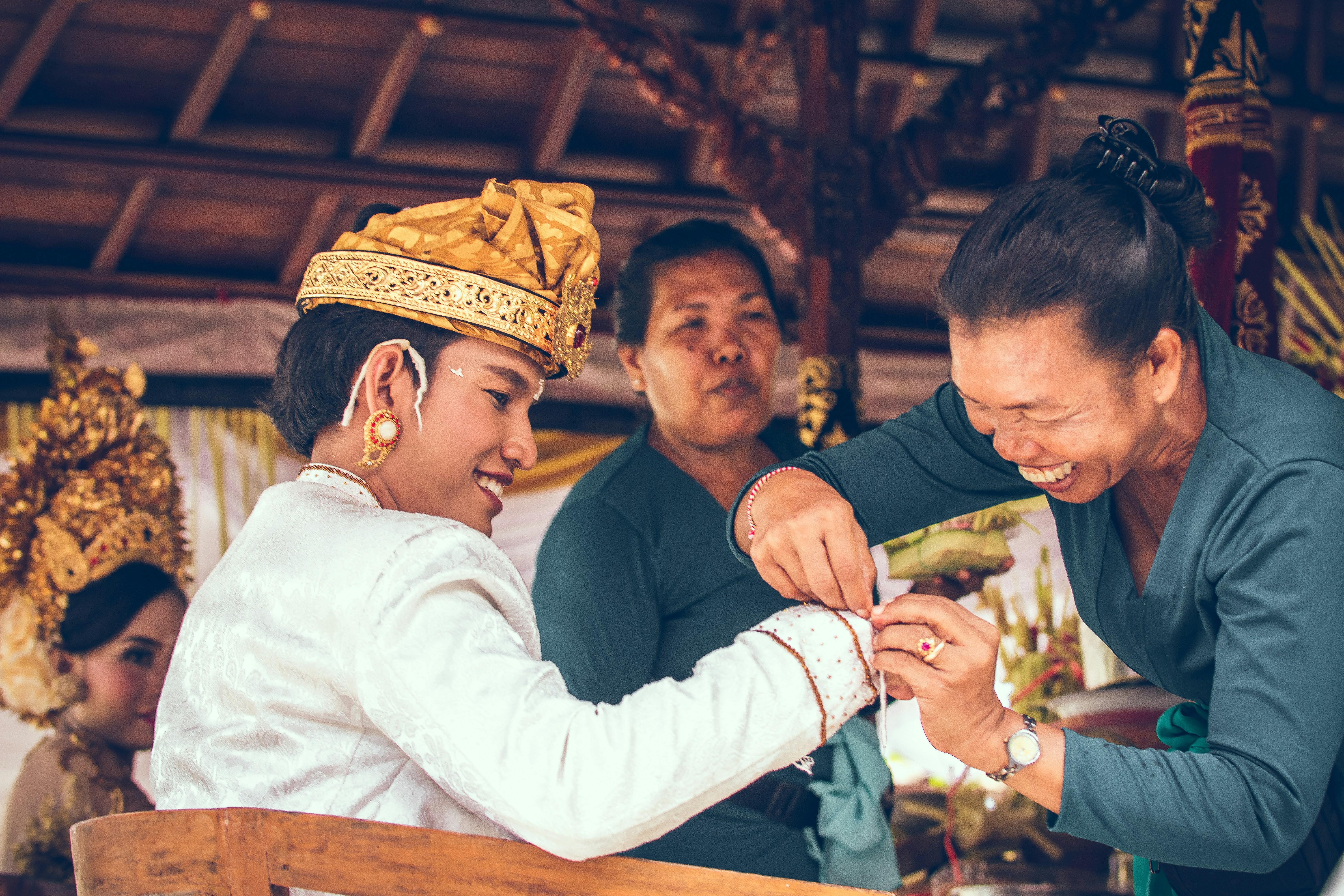 Woman dressing man photo Free Bali Image on Unsplash