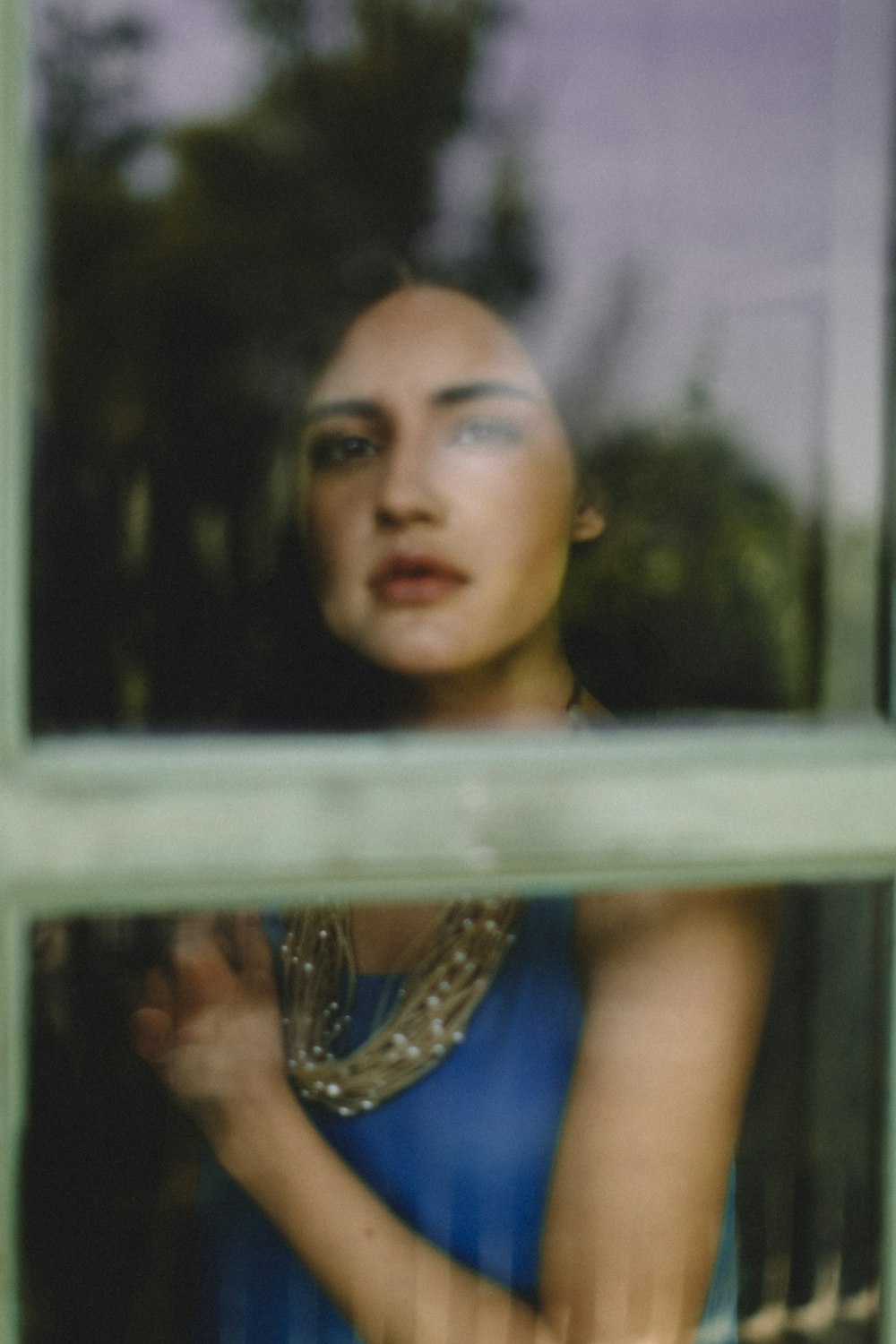 woman wearing blue tank top