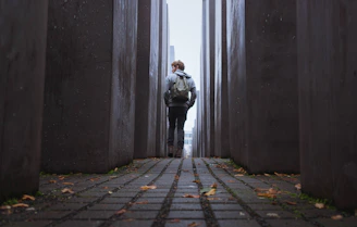man walking through gray walls. Gen Z revival?