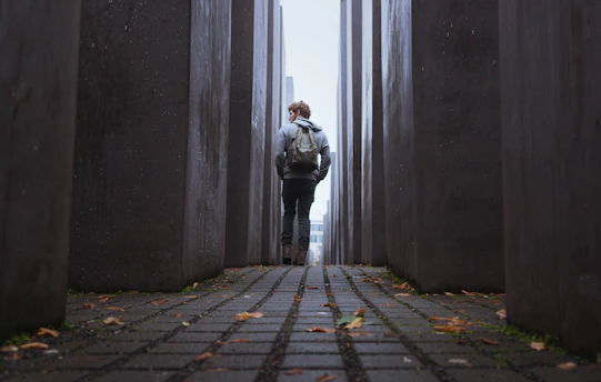 man walking through gray walls. Gen Z revival?