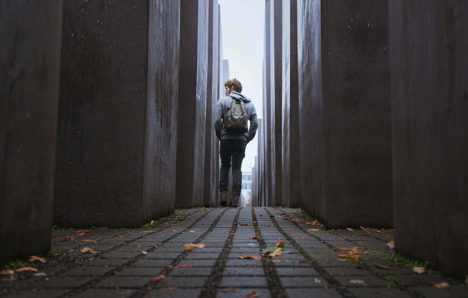 Sigma 19mm F2.8 EX DN sample photo. Man walking through gray photography