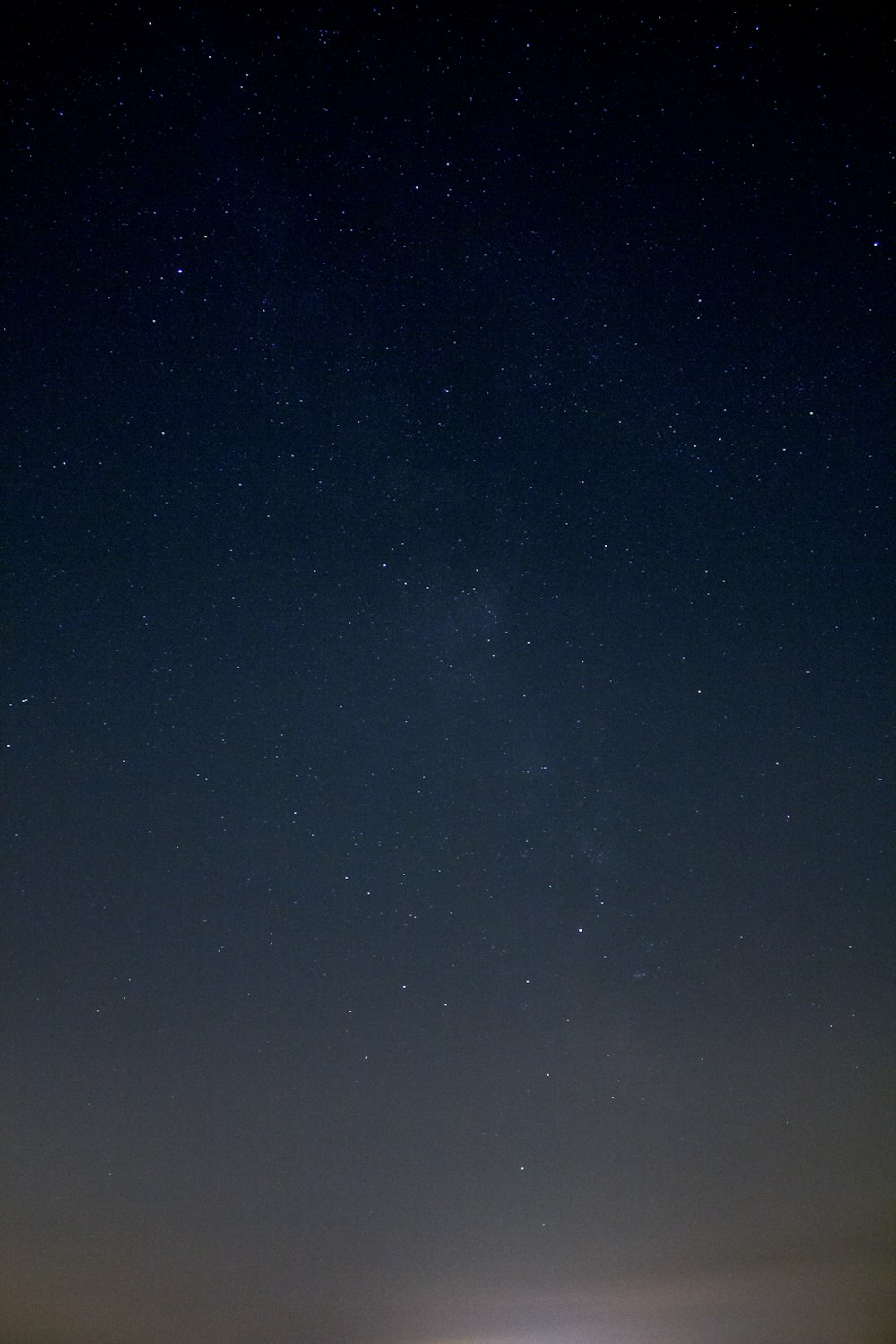 the night sky is full of stars above a field