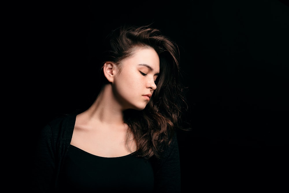 woman wearing black crew-neck shirt