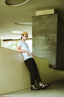 man leaning against wall