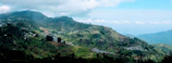 A panoramic view of Uttarakhand's lush mountain farms where millets grow.