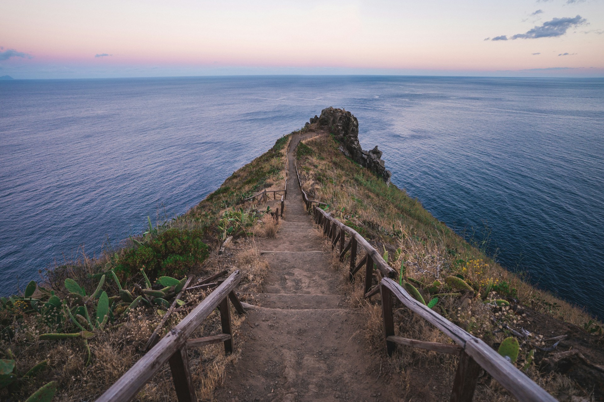 brown hallway between body of water
