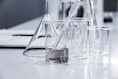 three clear beakers placed on tabletop