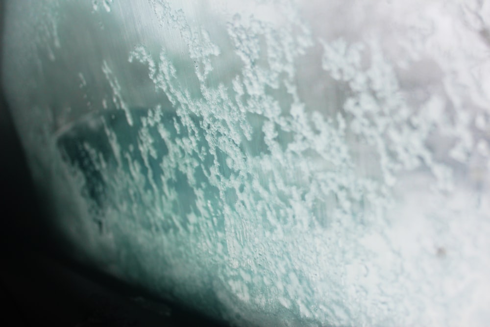 a close up of a window with water on it