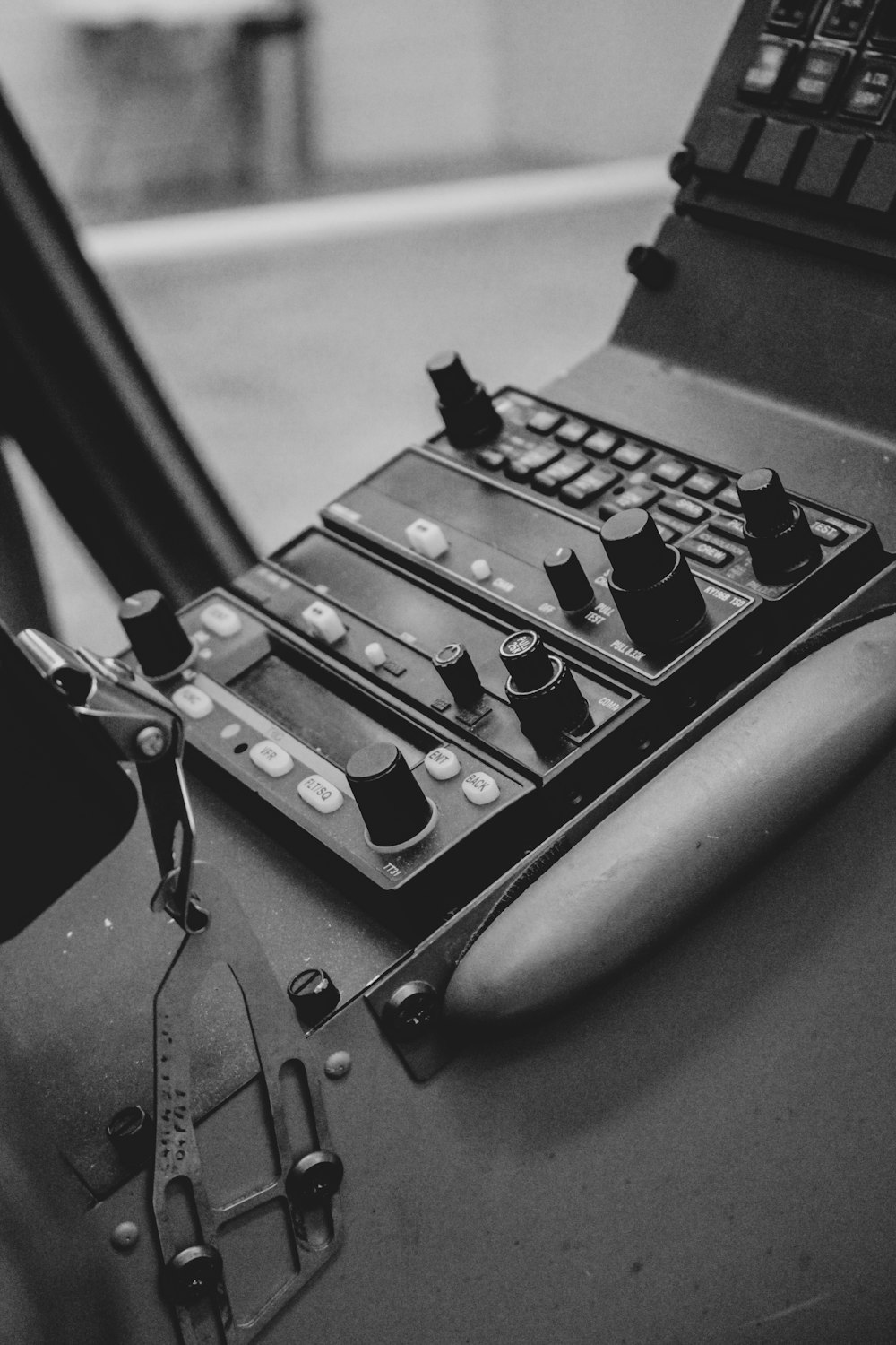 grayscale photography of vehicle control panel