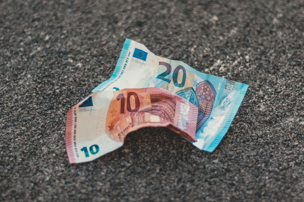 two 10 and banknotes on floor photo – Free Money Image Unsplash