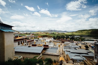 A scenic view of Sonadula village, showcasing traditional houses amidst greenery.