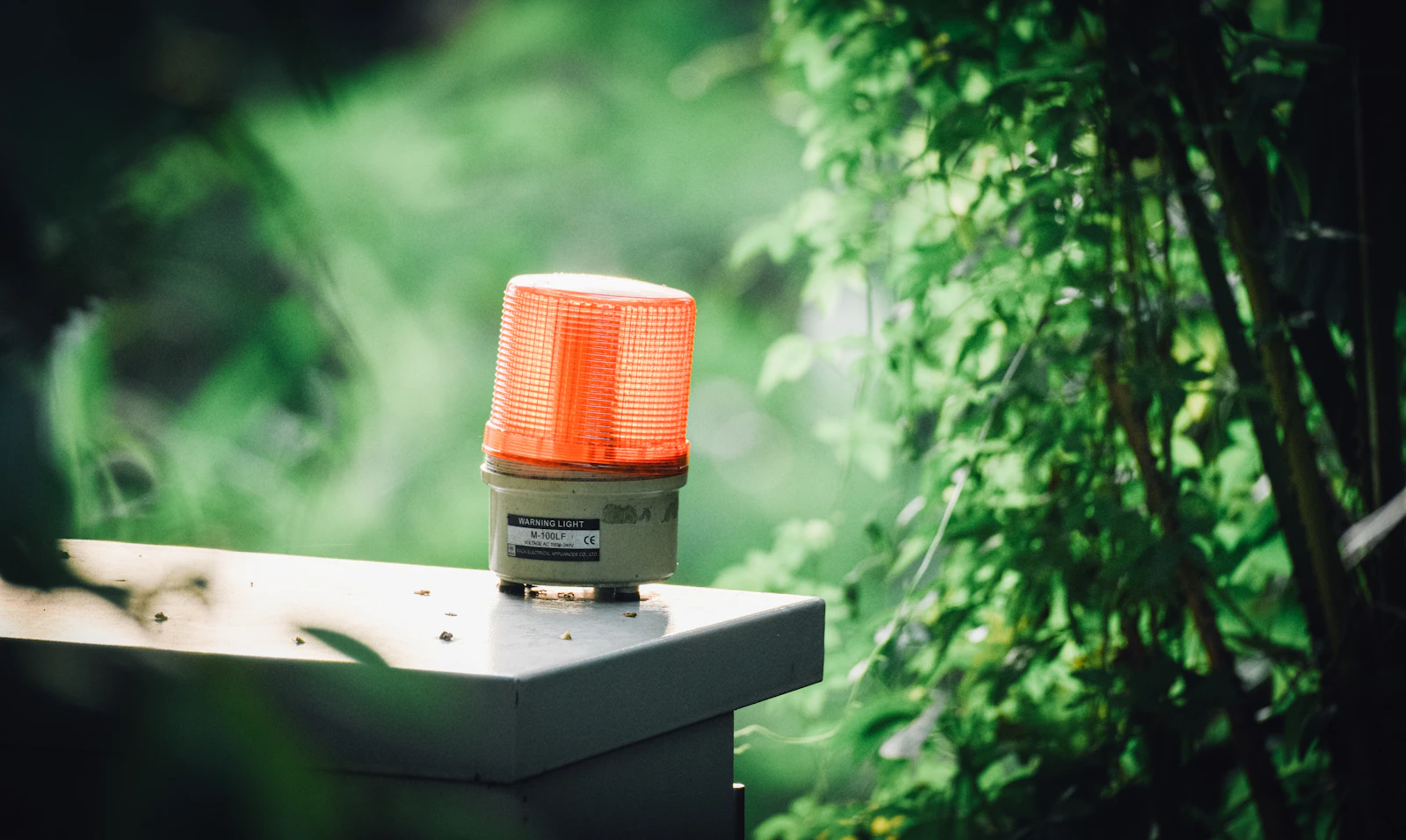 A red warning light glowing in a dark room