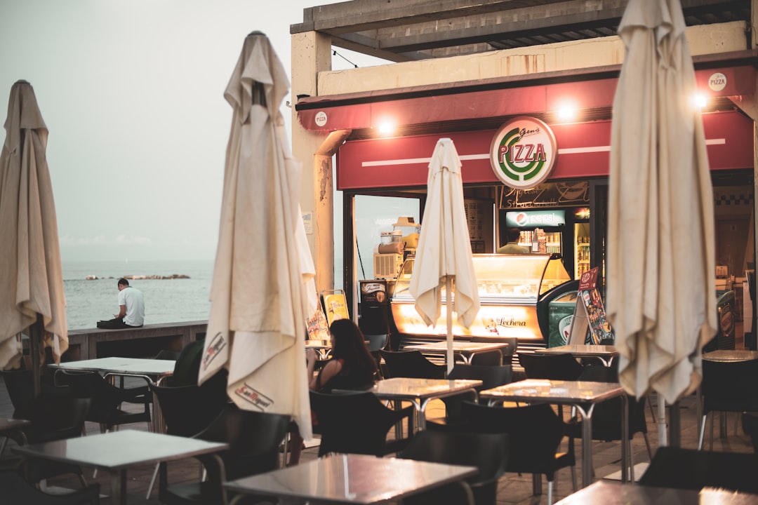 white dining tables near food establishment