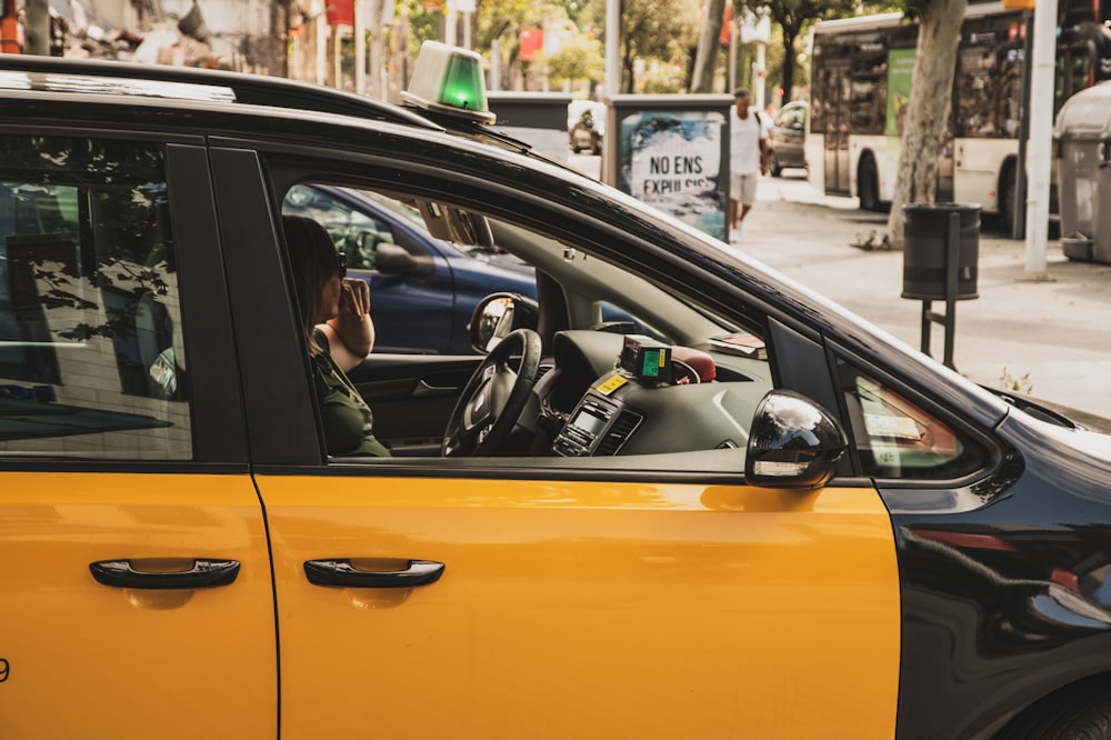 yellow car on roadway