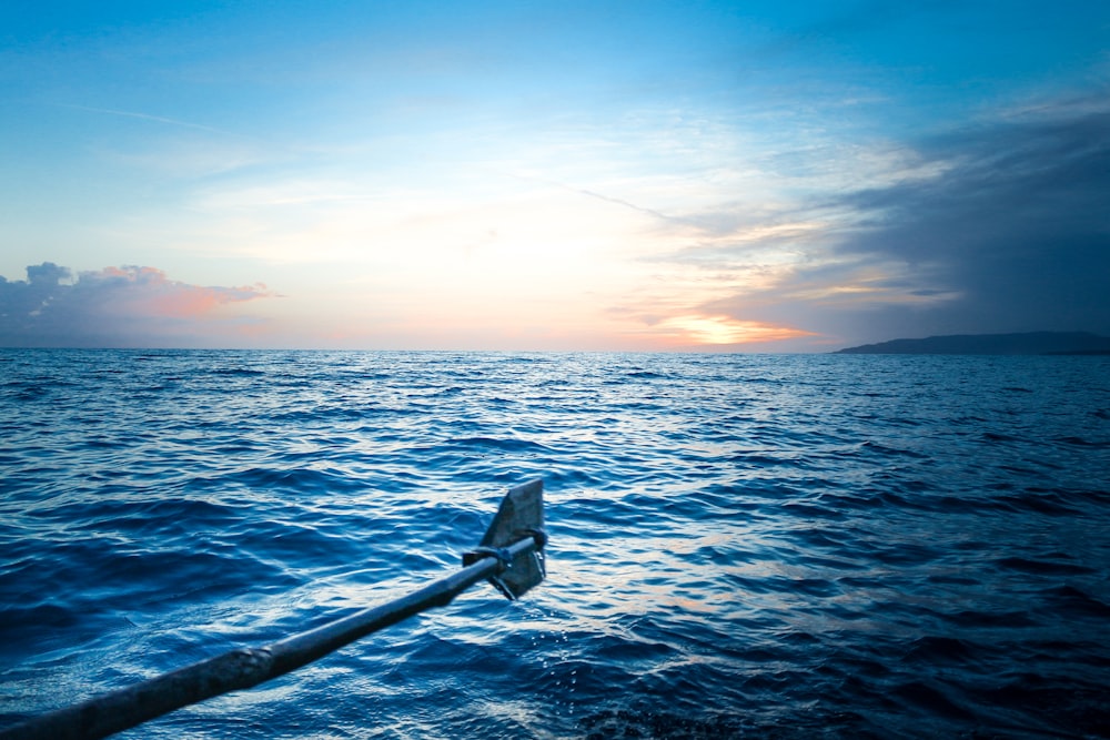 body of water during sunset