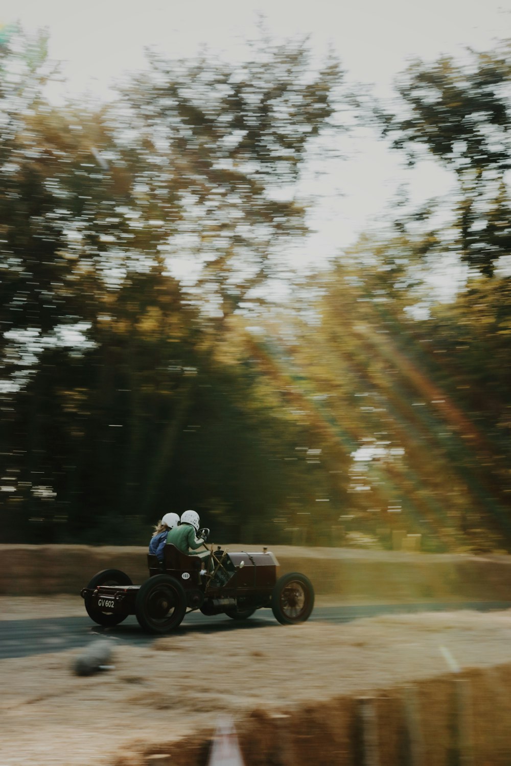 two person riding kart on roadway