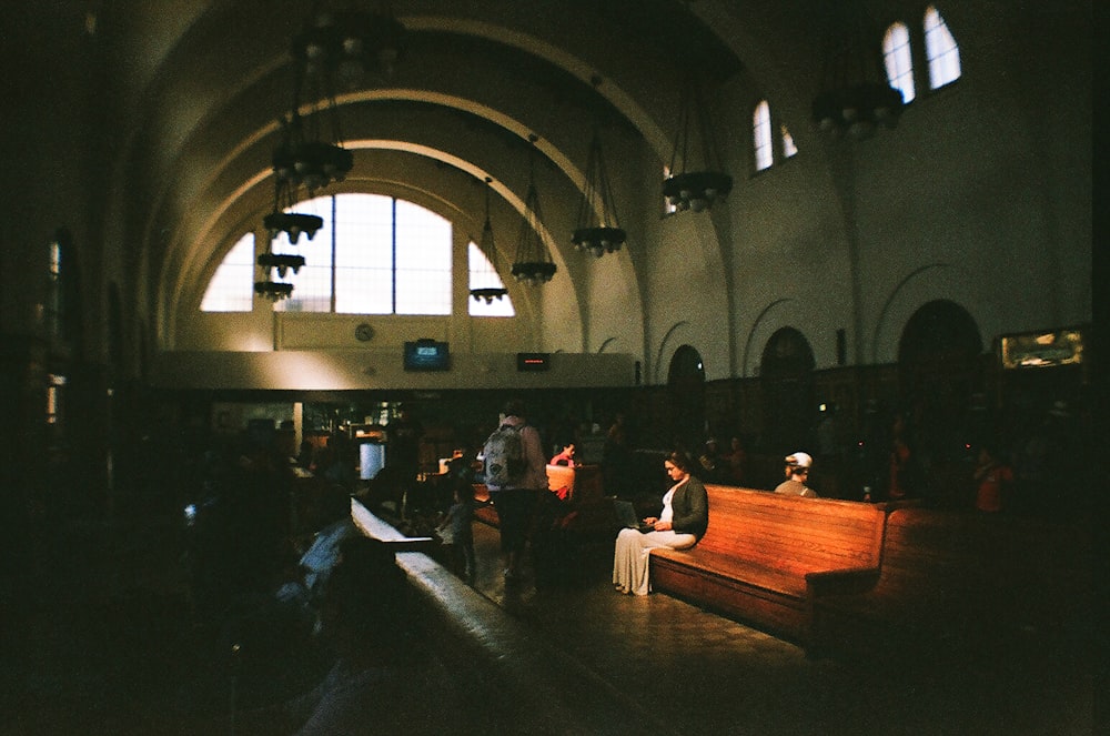 woman sitting on church pew