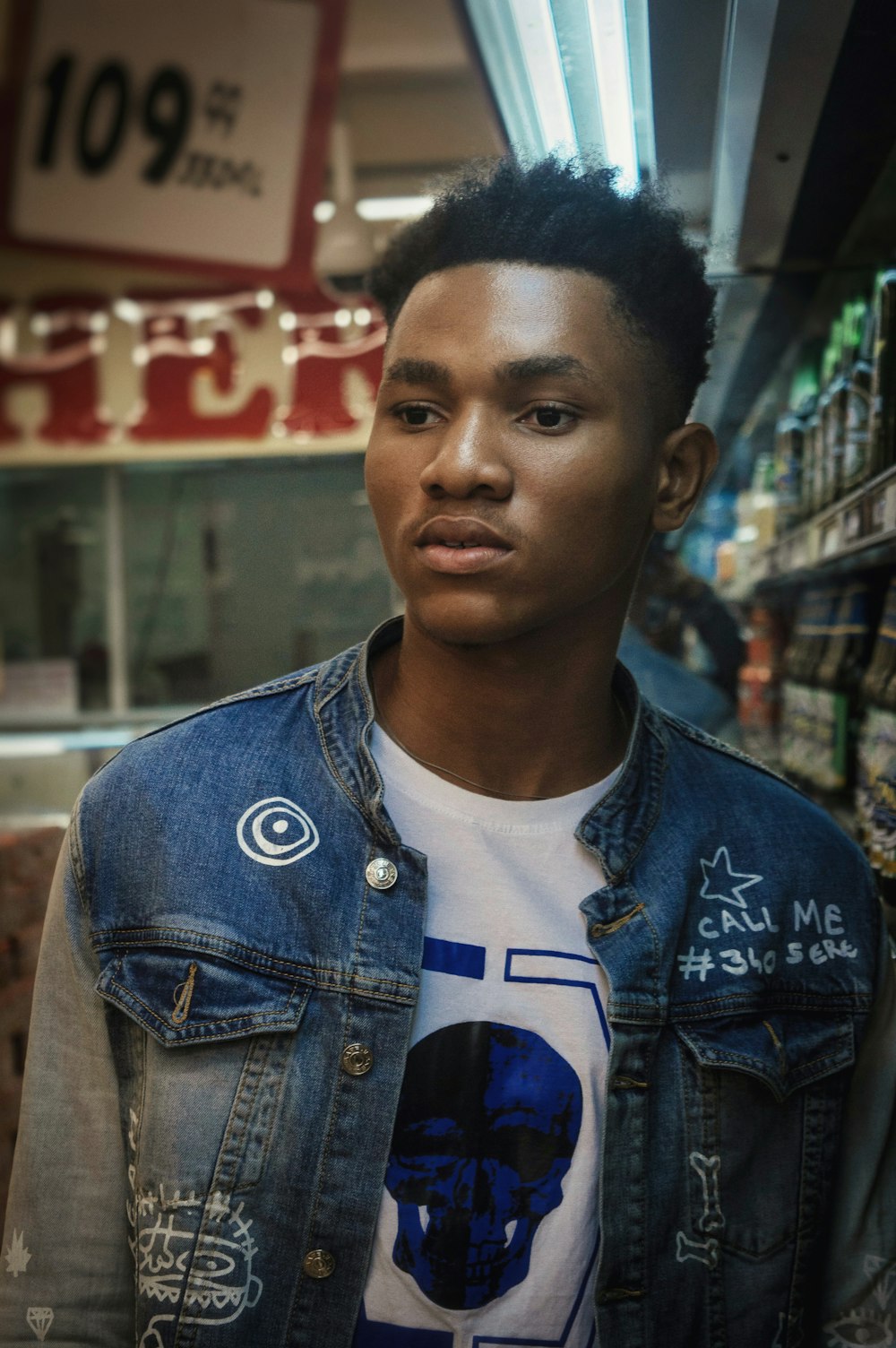 man wearing blue denim jacket