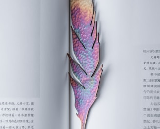 purple and brown leaf bookmark on page