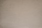 a brown paper background with a black and white cat sitting on top of it