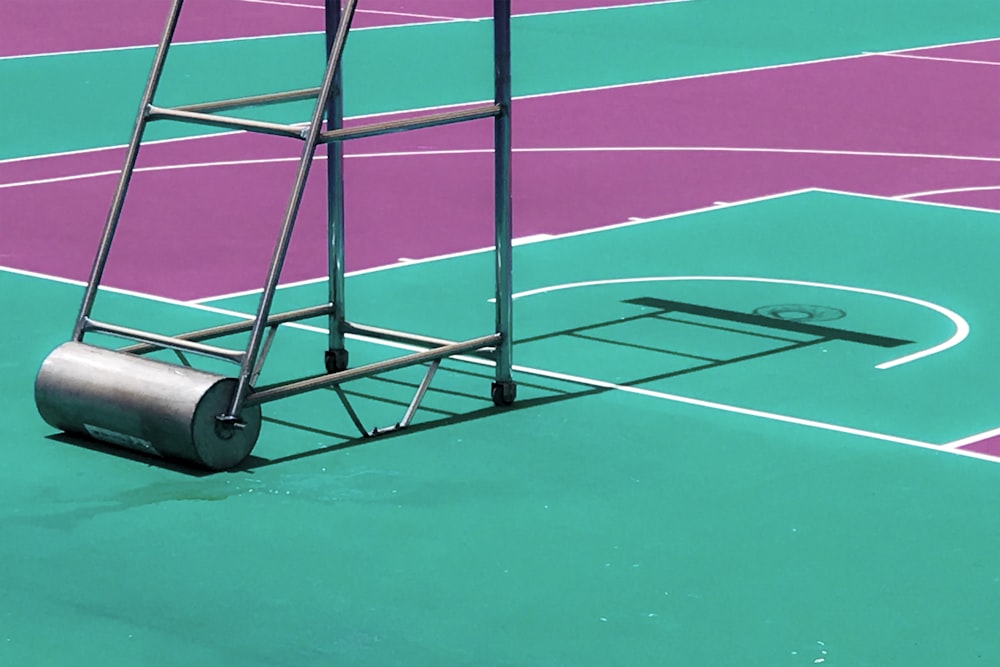 black steel basketball hoop stand on concrete surface