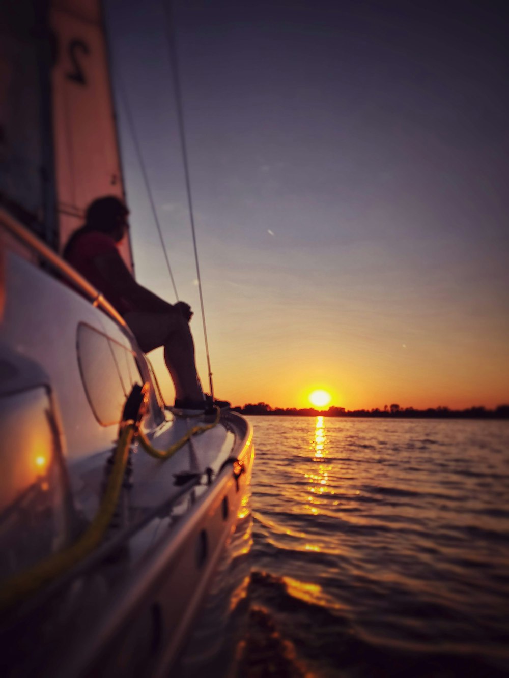 woman sitting on yacht during daytime