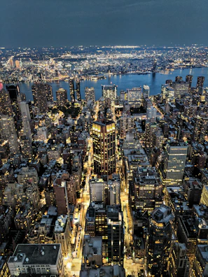 An aerial view of Kinshasa’s bustling urban landscape at dusk with warm city lights