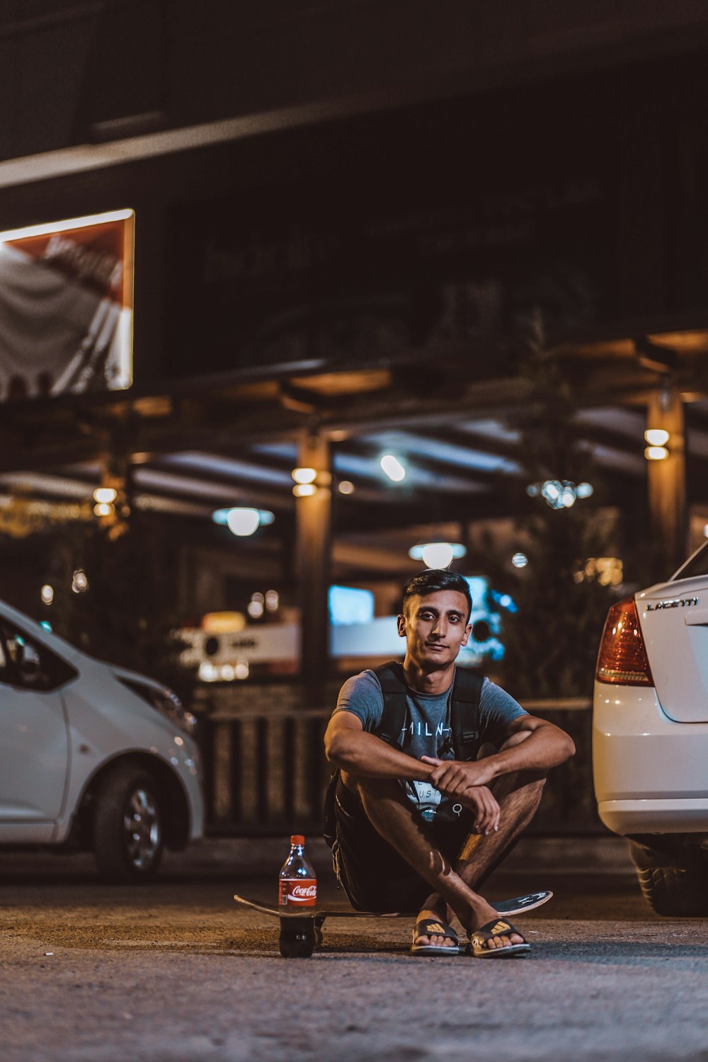 man sitting on skateboard