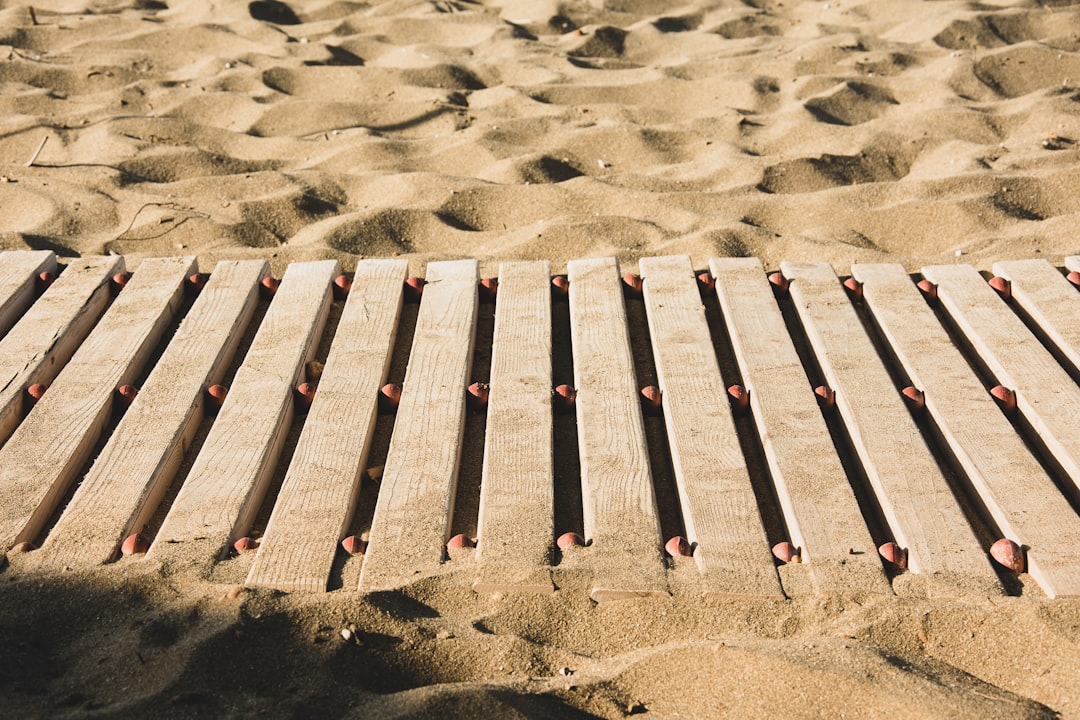 brown wood pallet on sand