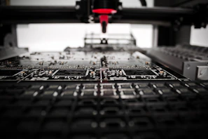 Close-up of hands assembling electronic components with precision.