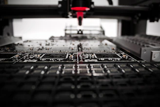 A sleek robotic arm assembling electronic components on a modern factory floor.