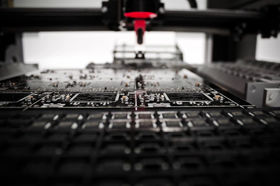 A close-up of a robotic arm assembling a circuit board with precision.