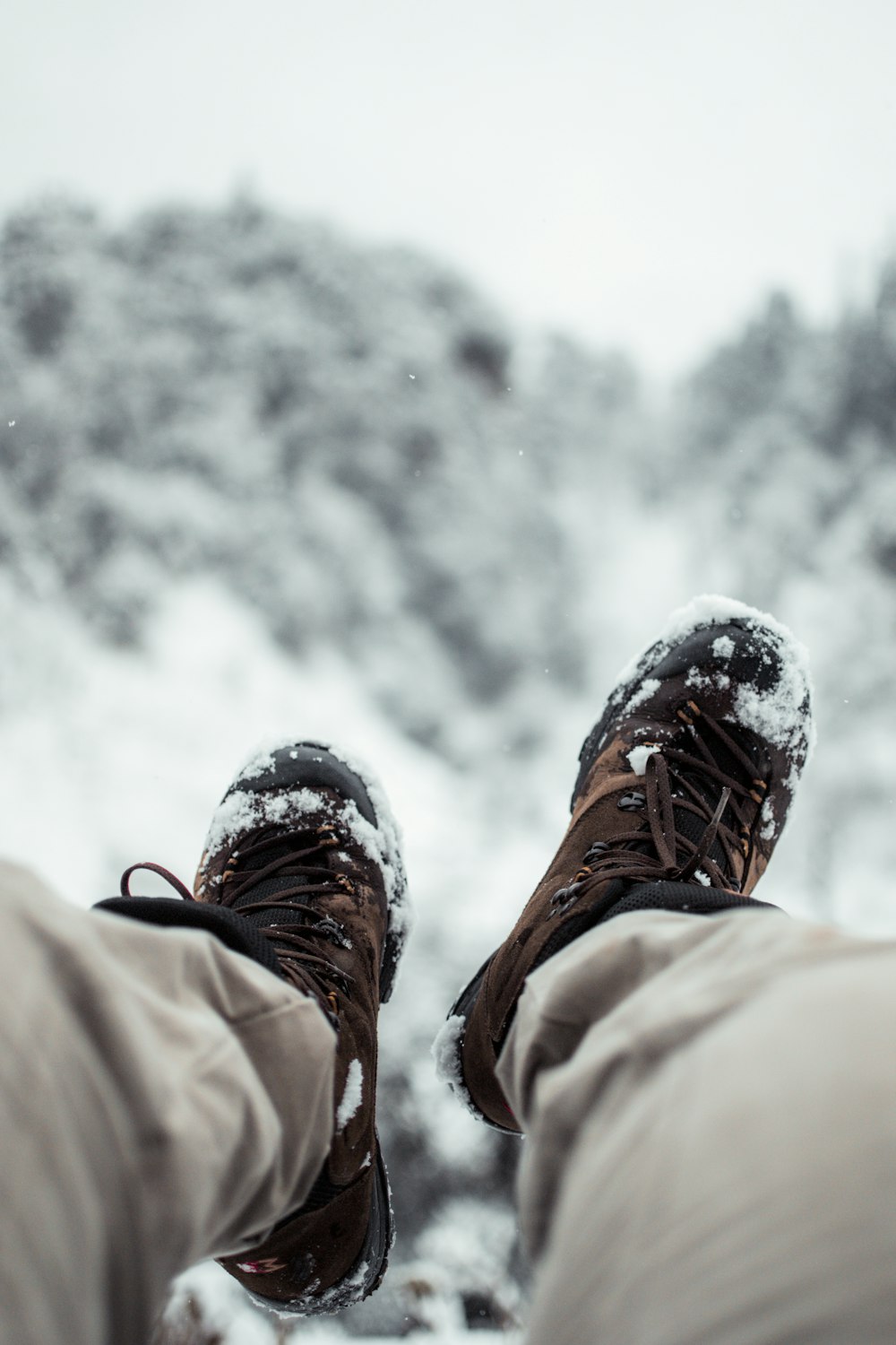 person wearing brown hiking shoes