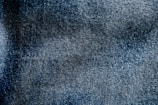 a close up of a blue area rug