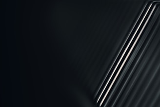 Modern adjustable curtain rods with metallic finish complementing a minimalist living space.