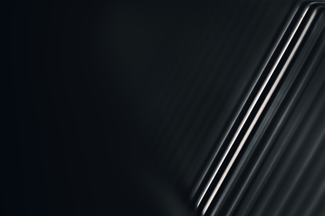 Artistic photo of steel rods reflecting light, symbolizing strength and future construction