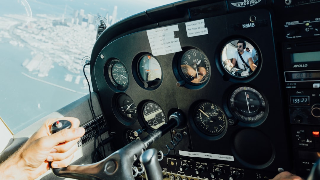 person holding aircraft wheel, Flying over San Francisco