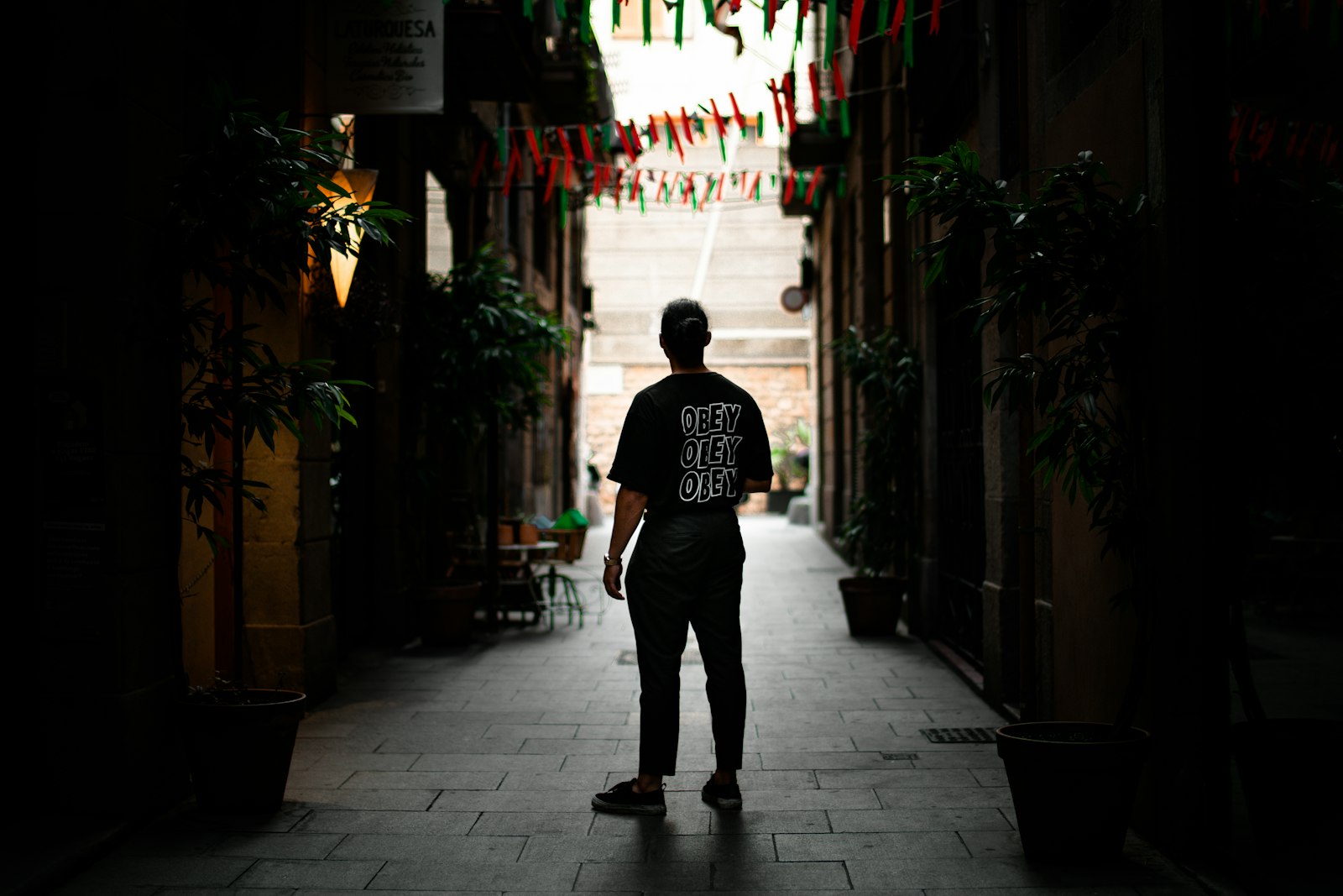 Samyang AF 50mm F1.4 FE sample photo. Man standing in alley photography