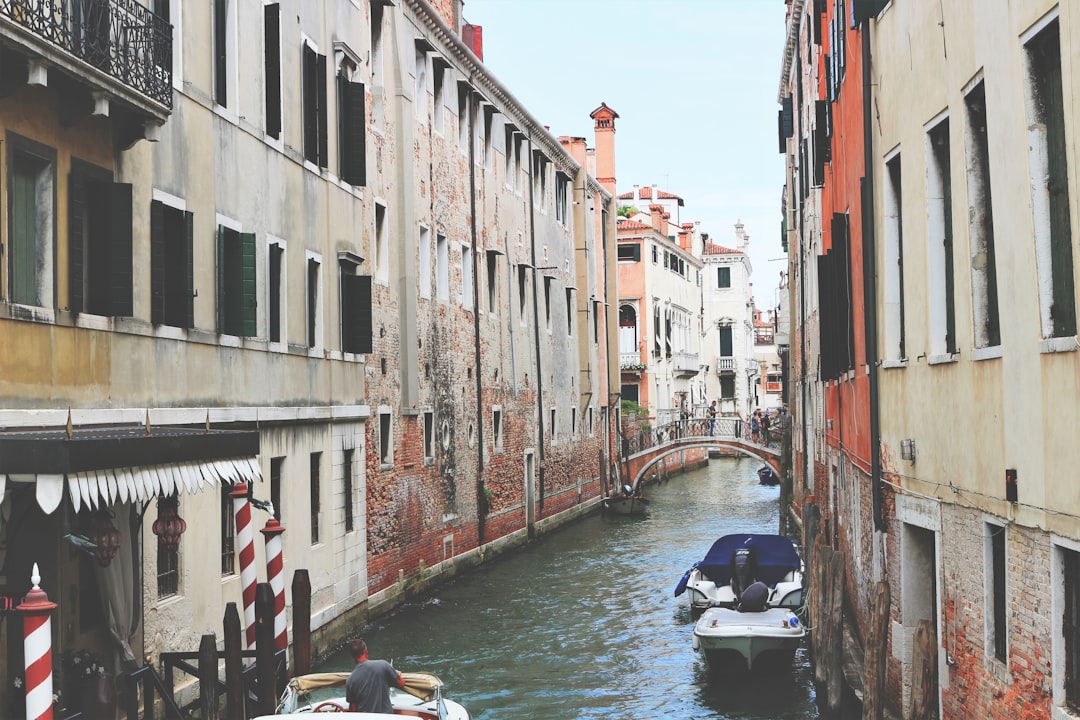 person sailing on Venice Italy Grand Canal,