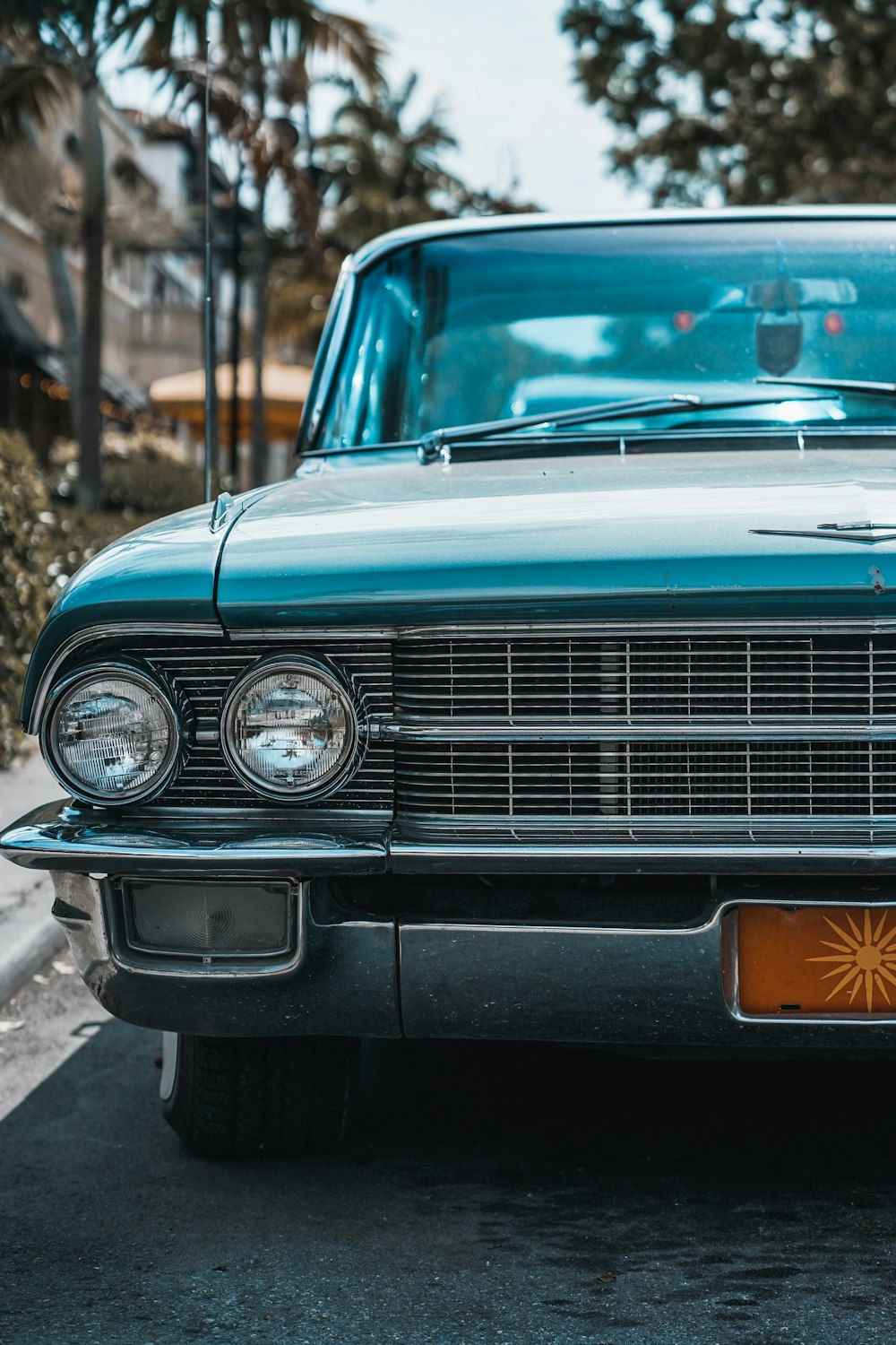 blue car on road