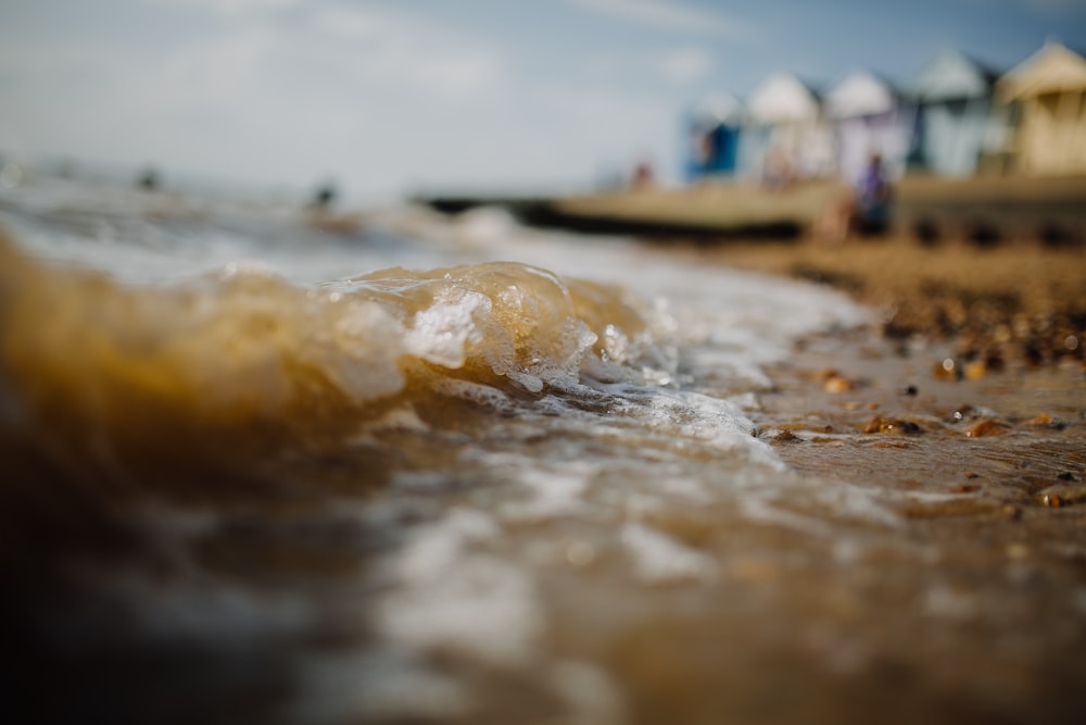 close up photography of ocean wave on seashore