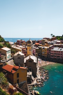A vibrant Caribbean coastal town with colorful buildings and clear blue skies.