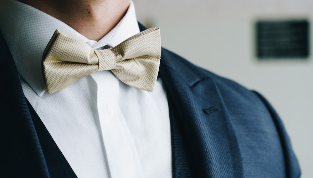 man wearing grey bow tie