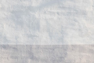 a white wall with a black and gray stripe