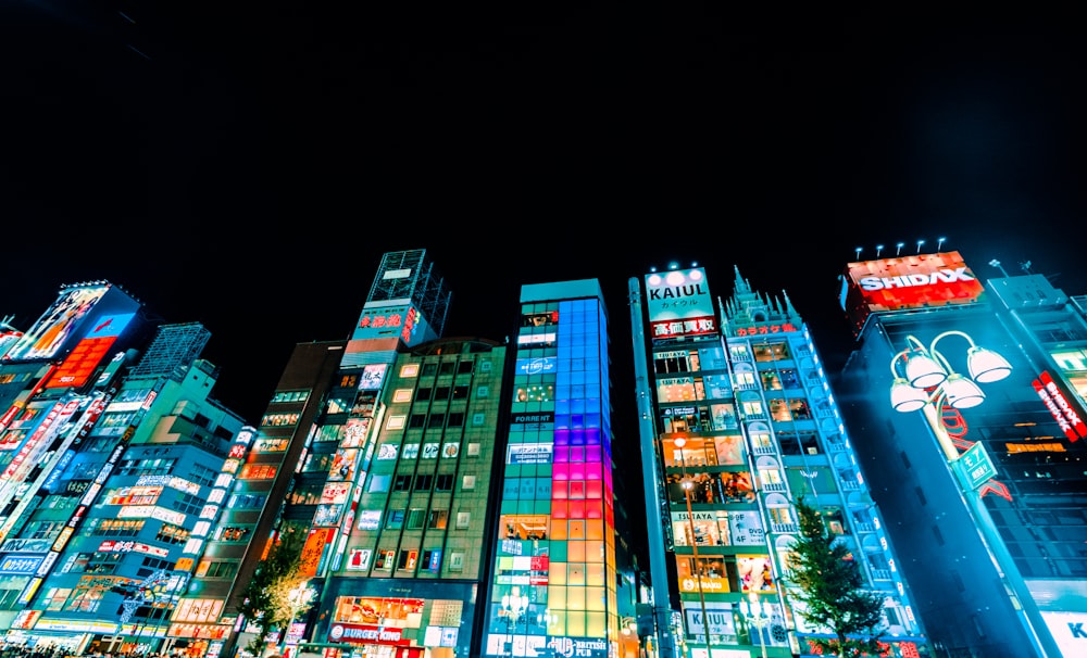 low-angle photography of buildings during nighttime