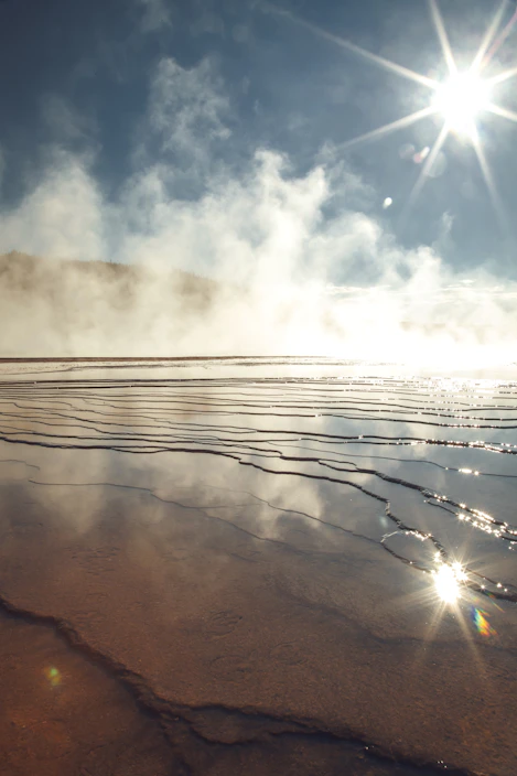 body of water under sunlight